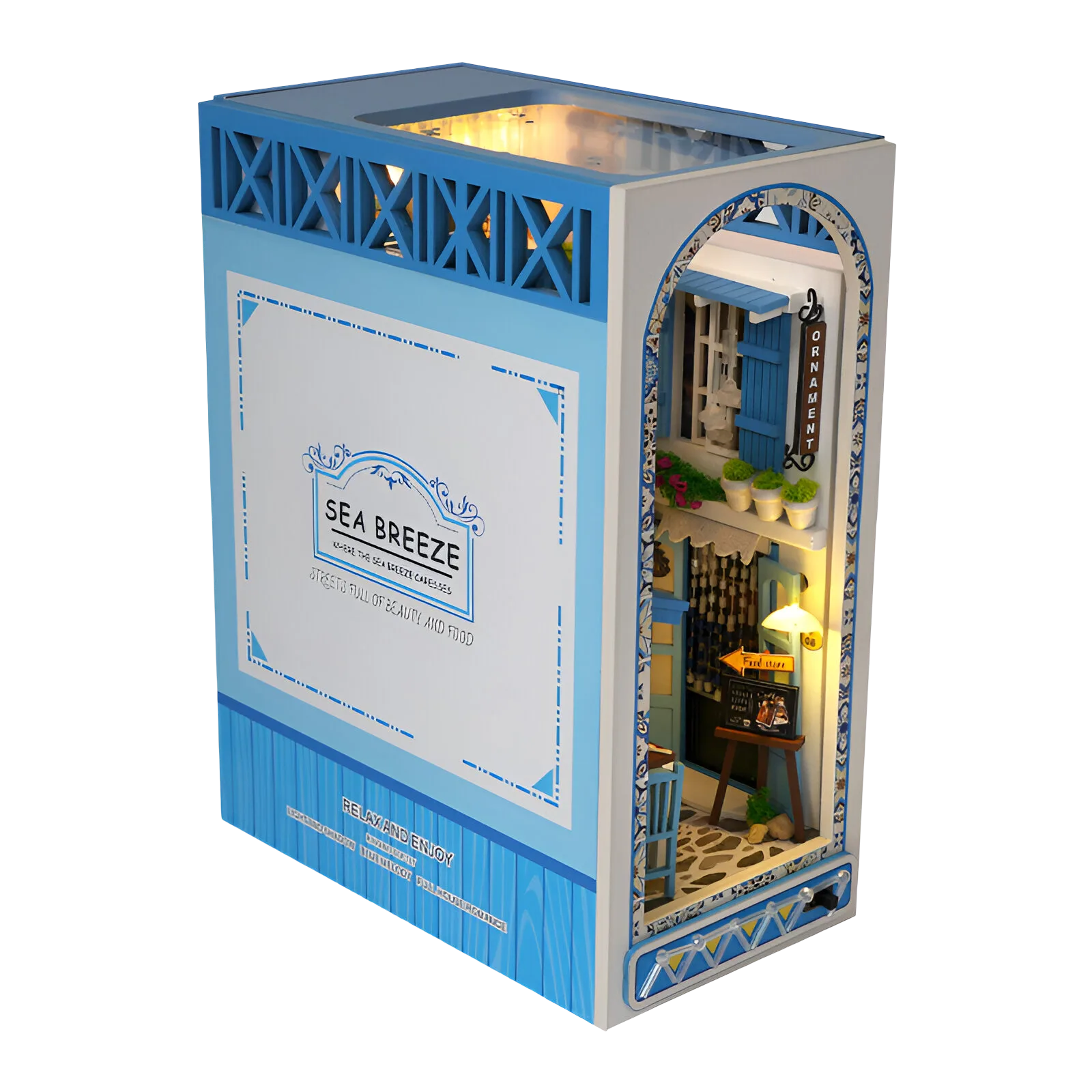 Greek Street miniature: a blue and white Mediterranean street scene with an ornament shop and glowing windows.